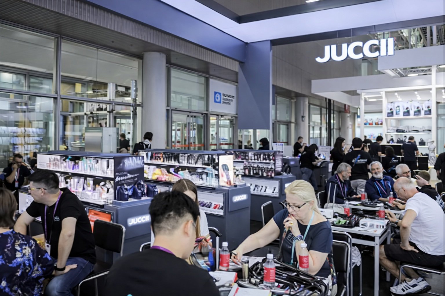 Busy booth with buyers negotiating